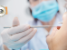 Close-up image of dentis using small mirror and carver when examining teeth of male patient.