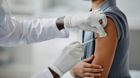 Child vaccination closeup.
