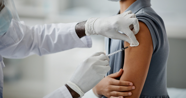 Child vaccination closeup.